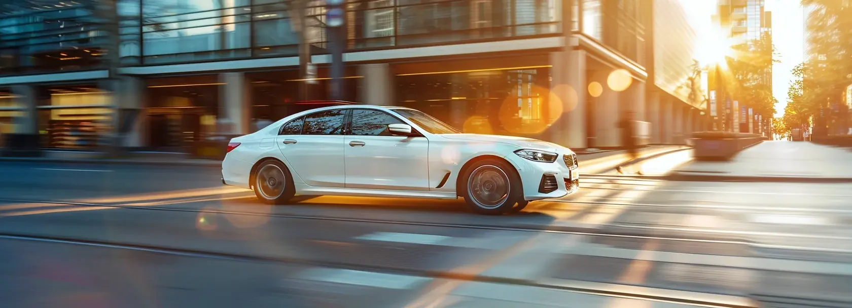 motion_44081_a_modern_white_sedan_driving_smoothly_through_a__d9012ece-7b21-4c0d-8616-44e0b902160d_3